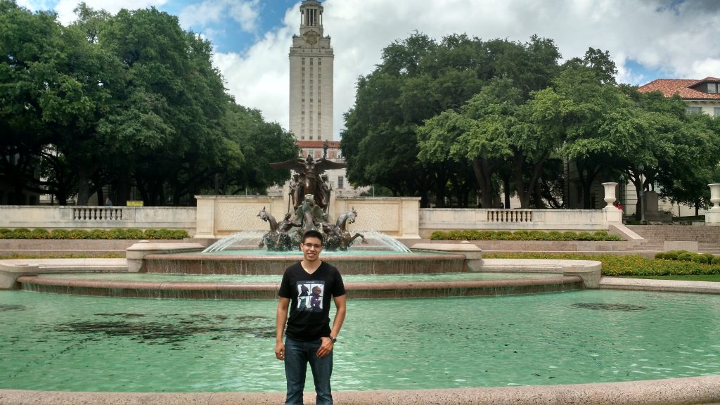 Daniel Chavarria in front of Littlefield fountain at UT