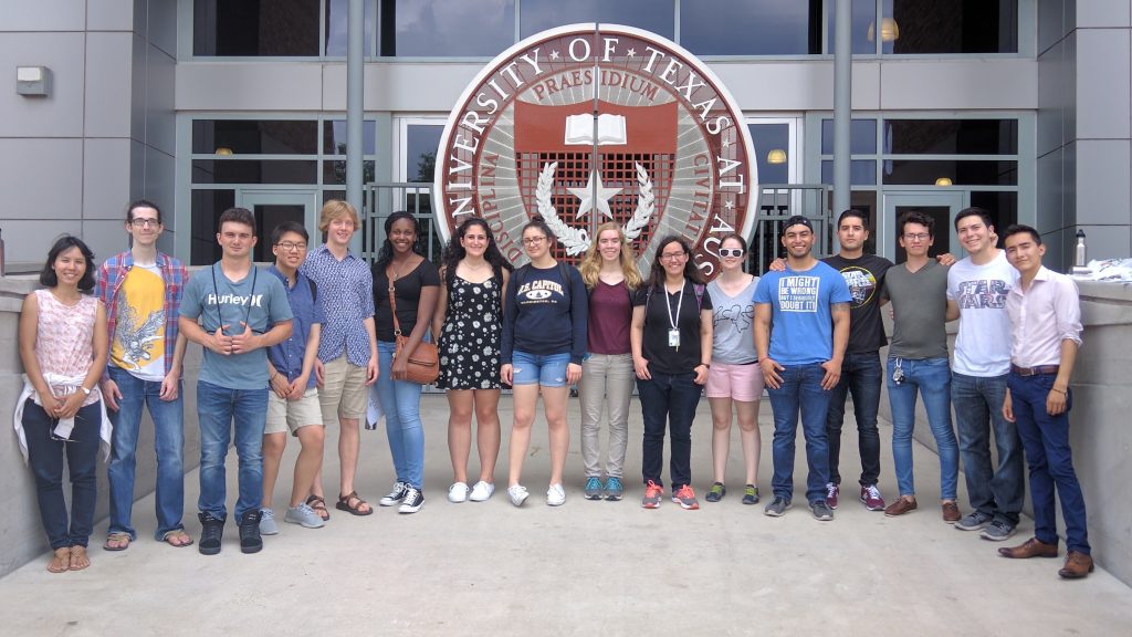 all 2017 visiting scholars lined up in front of the UT seal