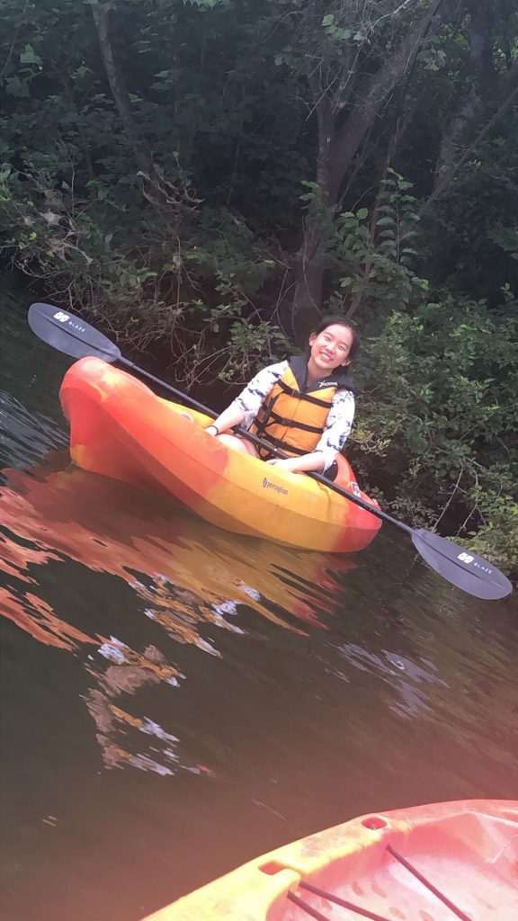 student in her kayak