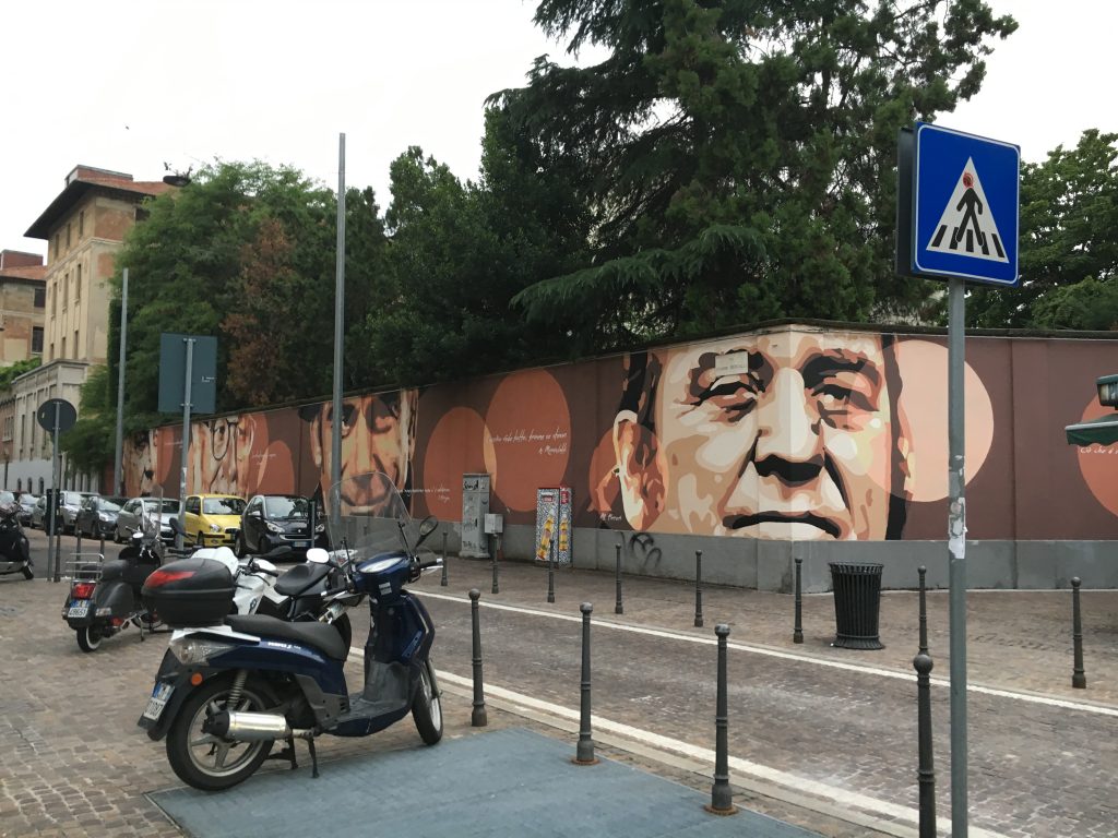 A mural with famous Italians we say on our walk