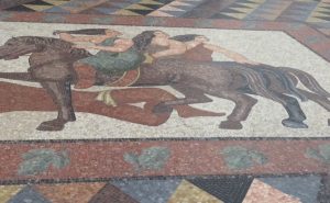 The ground floor mosaic at the bottom of the main stair. 