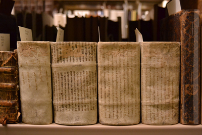 These four volumes of German poetry are wrapped in manuscript waste materials written in Hebrew. Photo By Alicia Dietrich.
