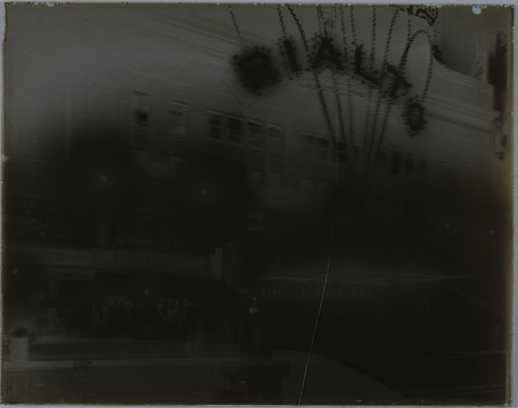 The glass plate negative of the Rialto Theater after treatment, with a faint mend line.