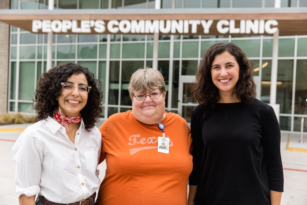 Left to right: Evelyn Marquez, Robin Rosell and Carrie Torn stand together outside of People's main building.