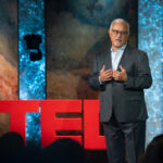 Dean Zayas delivering a TEDTalk