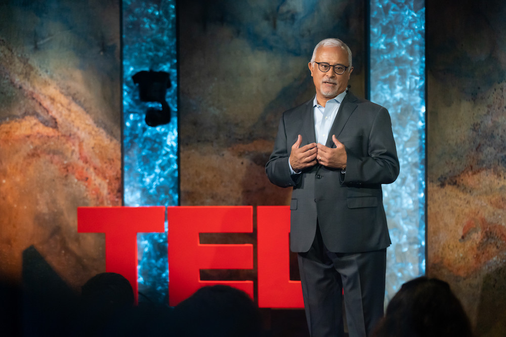 Dean Zayas delivering a TEDTalk
