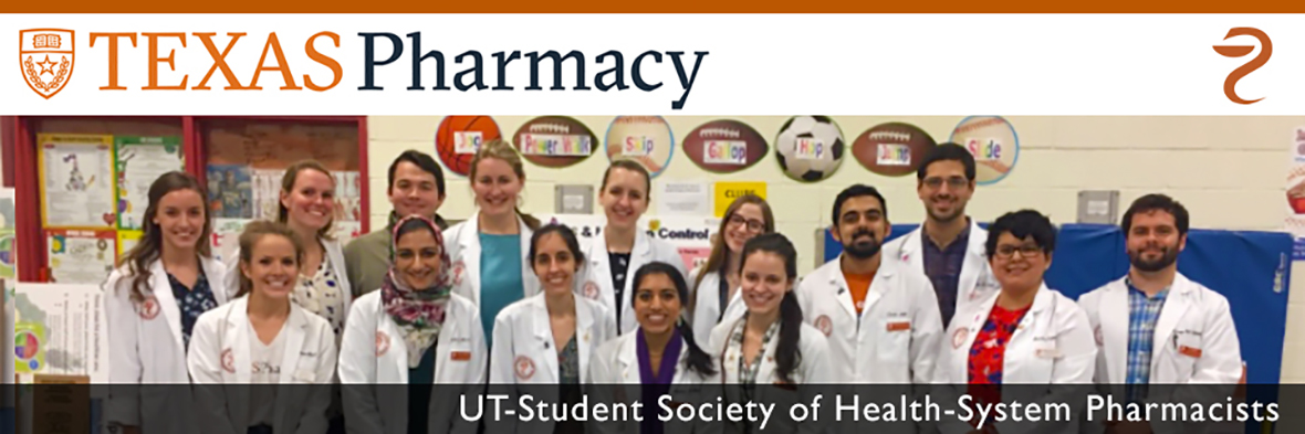 Group of students in lab coats - UT Student Society of Health-System Pharmacists