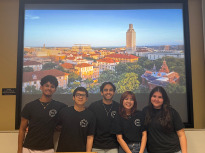 Group of ASC members in front of a picture of the UT campus