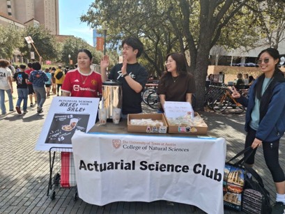 Actuarial Science Club table holding a bake sale on Speedway