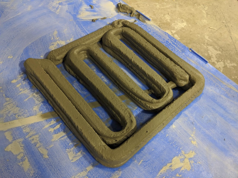 Additive Manufacturing of Concrete Structures