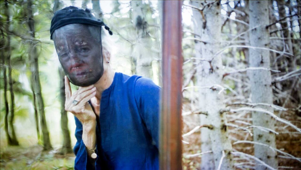 human wearing mask and blue shirt