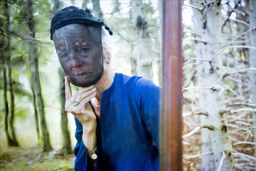 human wearing mask and blue shirt