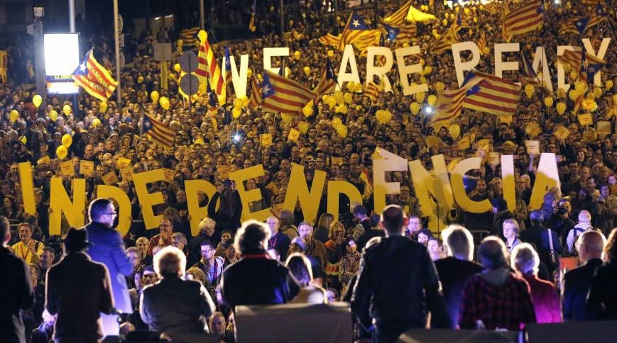 Pro-independence citizens hold up giant letters reading “We are ready,” and “Independence” during the final meeting in Barcelona on Friday November 7