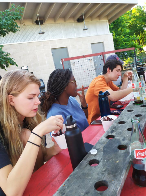 students eating food at food truck park