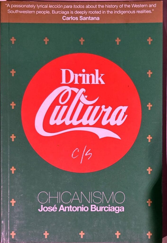 Book cover of Chicanismo. The cover features a parody of the Coca-Cola logo, with the brand's name replaced by "Drink Cultura" in a Coca-Cola-style logo. The background is green, with several crosses around it.