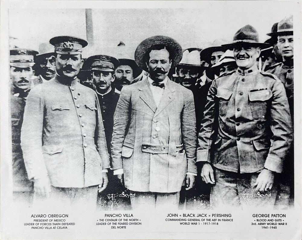 Poster of a photo of Alvaro Obregon, Pancho Villa, and John "Black Jack" Pershing, and George Patton taken in 1915. The poster lists the mens' names and birth and death years.
