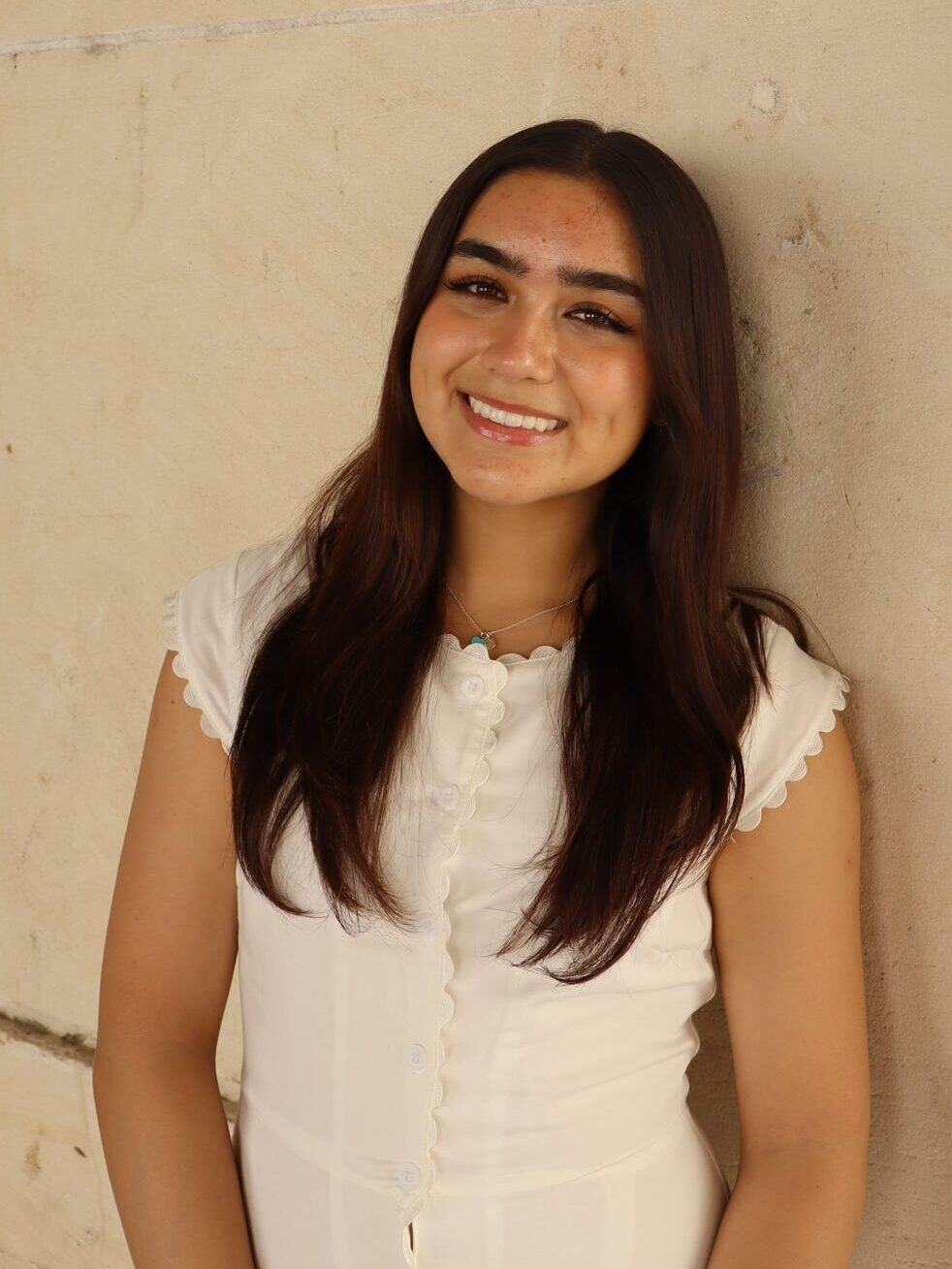 Young woman with brown hair mid-length smiling