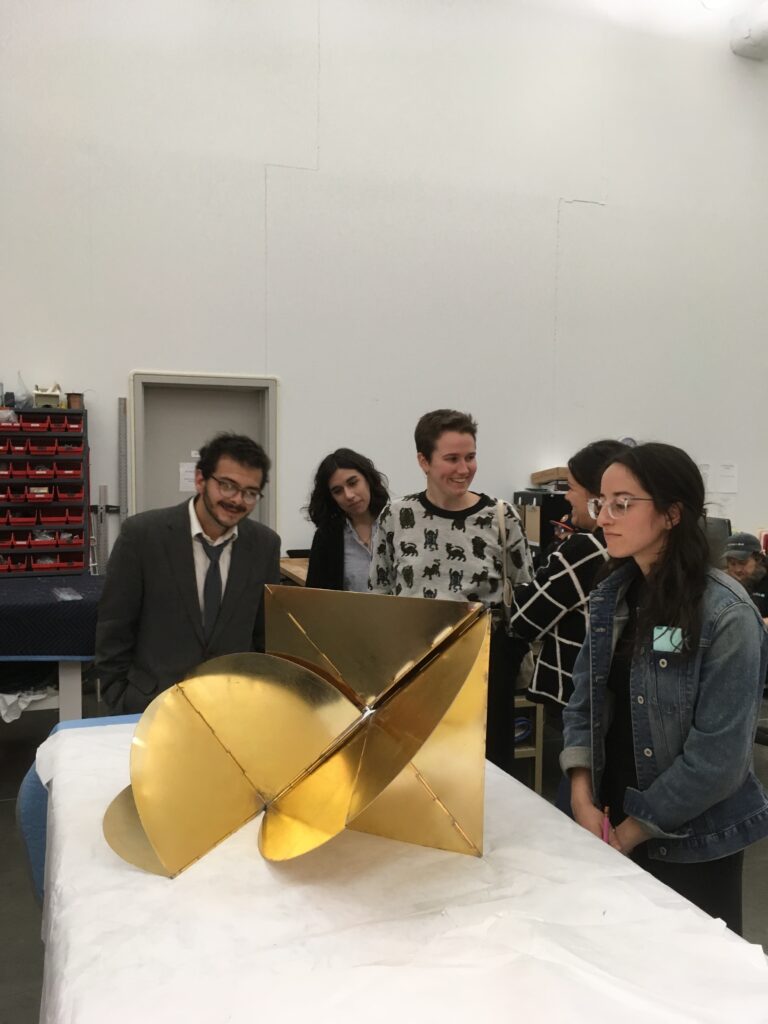 Students examine one of artist Lygia Clark's Bicho's in the Museum of Fine Arts, Houston vault