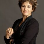 Portrait of curator giving lecture, Mari Carmen Ramirez