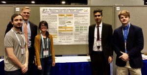 Picture of Efe Tuncer, Brian Wolshon, Nelida Herrera, Zhao Zhang, and Scott Parr with their CM2 poster "Effect of Shadow Evacuation on Megaregion Evacuations"