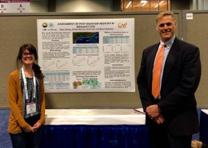 Picture of Nelida Herrera and Brian Wolshon with their CM2 poster, "Assessment of post-disaster reentry in Megaregions”