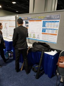 Picture of Yantao Huang with his CM2 poster with Dr. Kara Kockleman, "How Will Self-Driving Vehicles Affect Megaregion Traffic? The Case of the Texas Triangle"