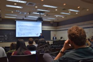 A student looks on as the presentation begins