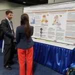 Picture of Paulina Urbanowicz-Pollock with her CM2 poster with Lisa Loftus-Otway and Stephanie Levine, "Identifying Organizational Changes to Facilitate Metropolitan Planning Organization Mega-Region Planning"