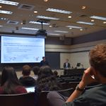 A student looks on as the presentation begins