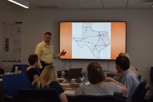Ray Miller, Jr., AICP, giving an overview of transportation in the Texas Triangle