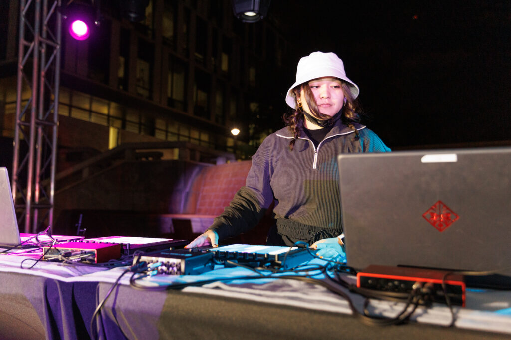 Student DJing at a live event