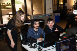 Students working together on a laptop during the VR Austin Jam