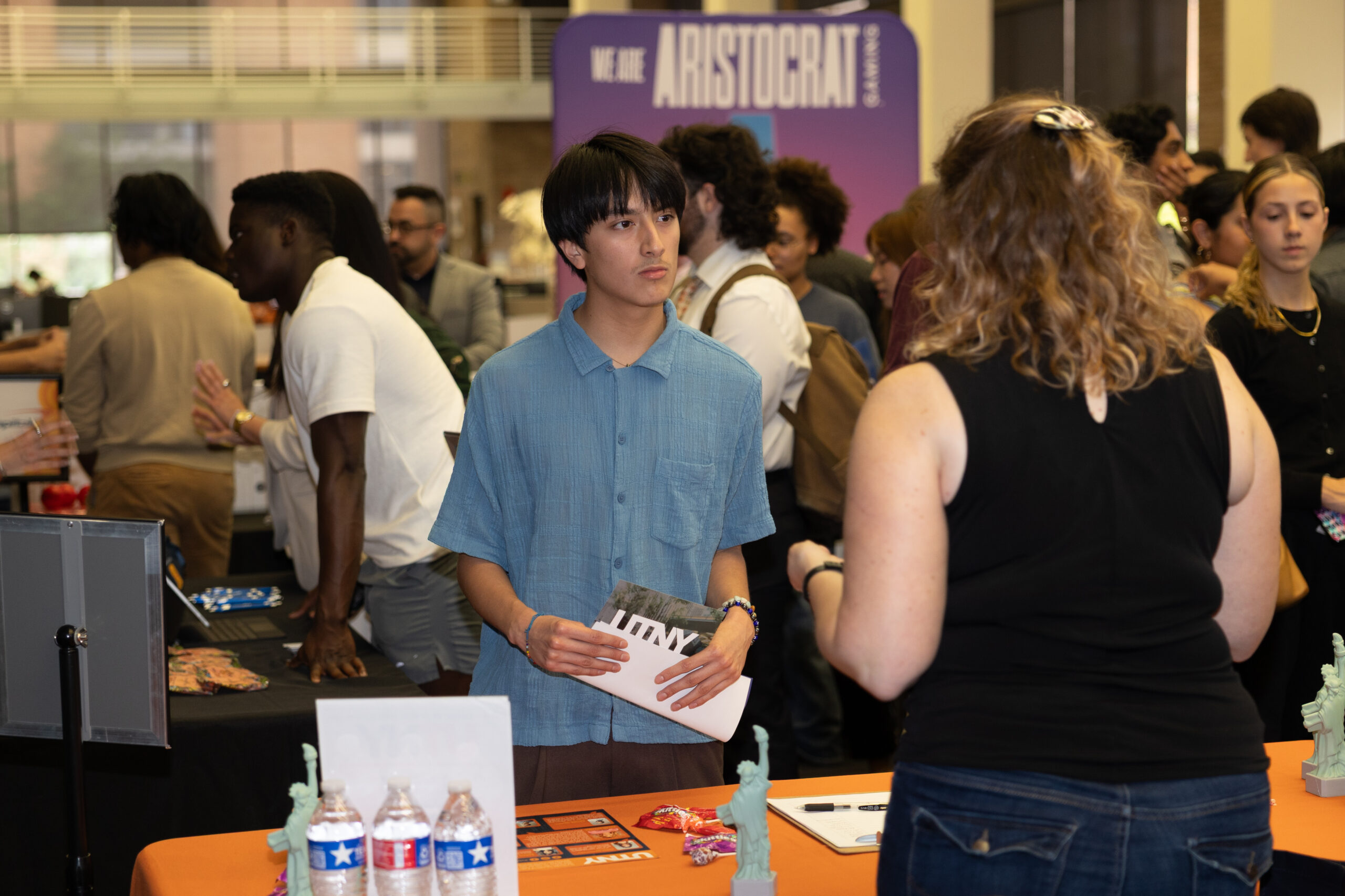 A student speaks with an employer at a career fair