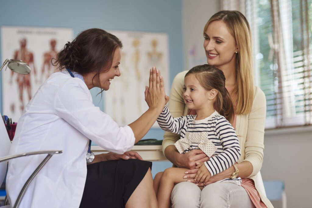 Doctor giving her patient a high five