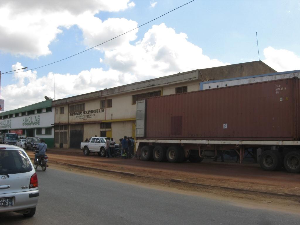 Large container truck parked in front of the warehouse