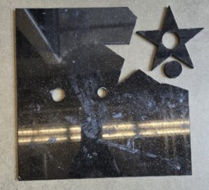 A star cut from a granite tile