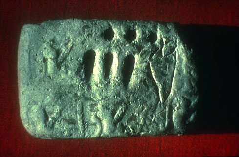 (Fig. 5)  Incised tablet from Godin Tepe, Iran, ca. 3100 BC. courtesy Cuyler Young Jr.,  Royal Ontario Museum, Toronto. The incised sign stands for a jar of oil, the circular signs stand for 10, the wedges for 1 = 33 jars of oil.
