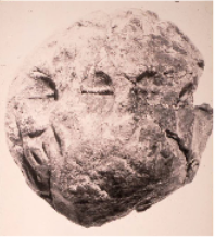 Envelope showing the imprint of three ovoid tokens with an incised line representing jars of oil, from Habuba Kabira, Syria, ca. 3300 B.C. Courtesy Museum für vor- und Frühgeschichte, Schloss Charlottenburg, Berlin.