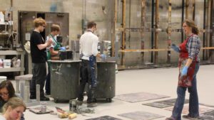 Professor Karen Maness teaches students in the Bass Concert Hall scene shop. 