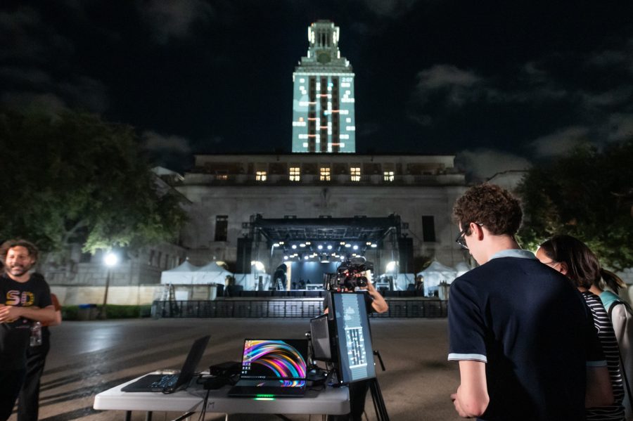 Students play Tower Tumble as it is being projected in real time onto the UT Tower photo credit Thomas Meredith