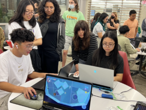 UT Austin students playing original video games created by the Game Development and Design Program during Digital Demo Day 2023