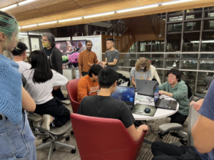 UT Austin students playing original video games created by the Game Development and Design Program during Digital Demo Day 2023
