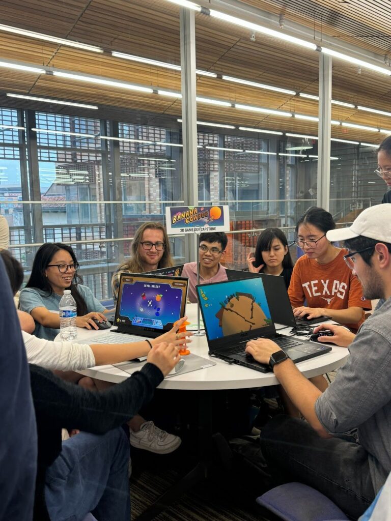 Demo day attendees playing games on laptops 