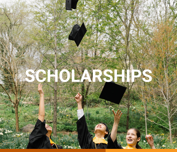 Banner that says "scholarships" in white text. The background shows three students throwing their graduation caps in the air; there are threes and foliage behind them. The students are looking up and laughing.