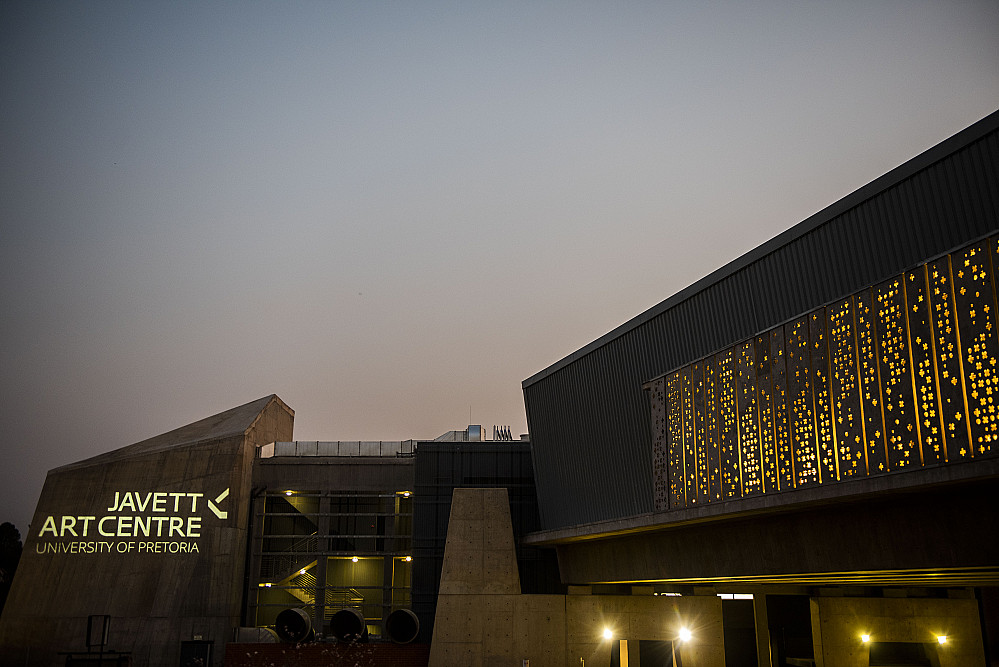 Exterior photo of the Javett Art Centre building at sunset. 