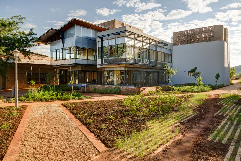 Exterior photo of the Research Commons building, including the surrounding garden and pathways.