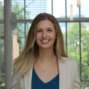 Brittany Heiser smiling in an outdoor city setting