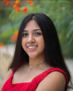Ashmita Kalyanaraman smiling in an outdoor setting