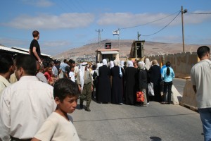 Women stand near an Israeli checkpoint. Photo Credit: Michael Loadenthal Creative Commons Flickr. 