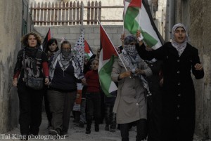 Palestinian women participating in a protest march. Photo Credit: Tal King Creative Commons Flickr. 